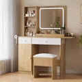 Vanity with mirror and light, featuring drawers and a padded stool, equipped with power outlets, suitable for bedrooms and living rooms.