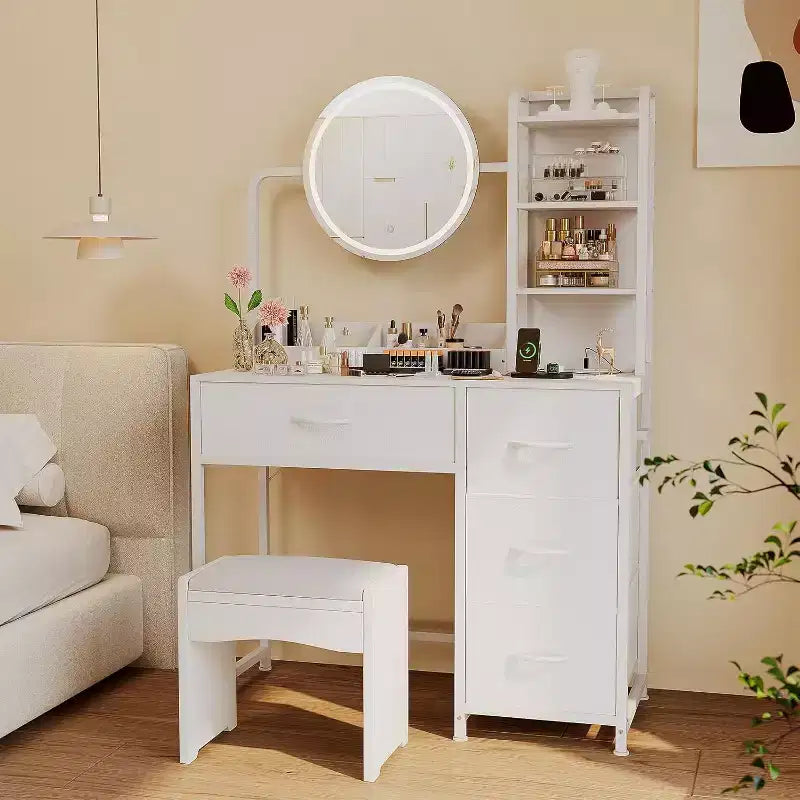 Tocador pequeño con espejo redondo iluminado y toma de corriente, mesa de maquillaje moderna con 4 cajones de tela y 3 estantes, para dormitorio