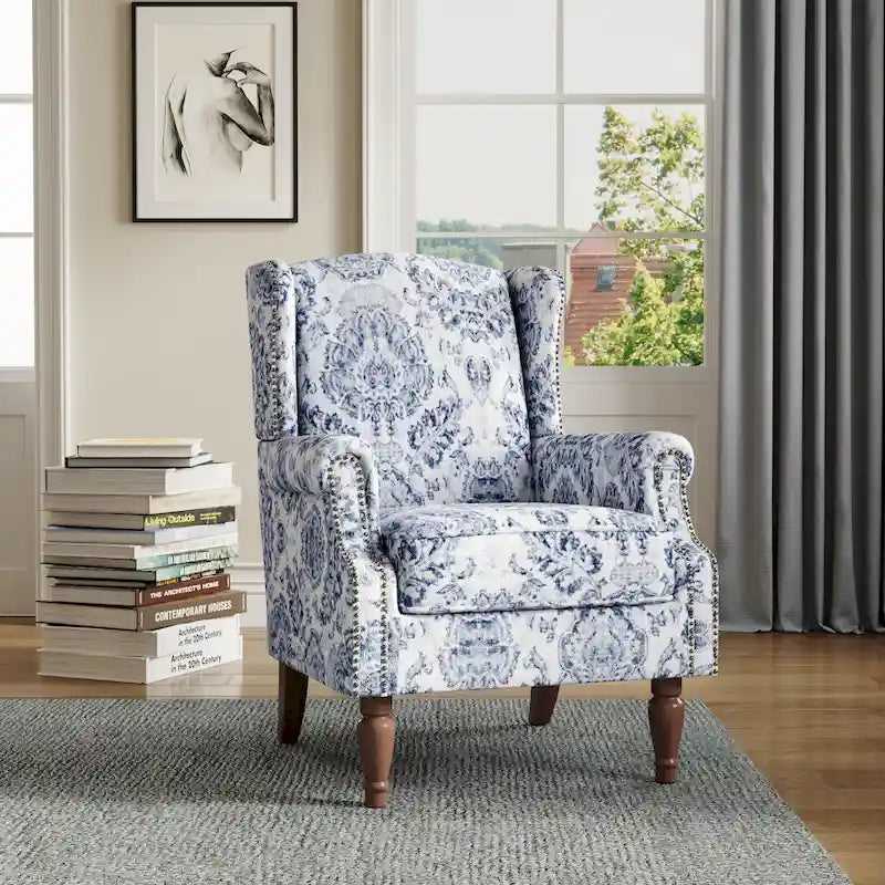 Sillón decorativo tapizado con ribete de tachuelas
