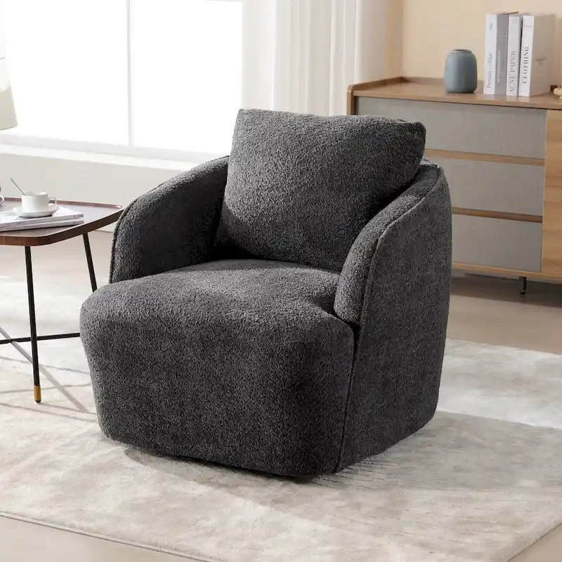 Sillón tipo barril giratorio tapizado en tela bouclé con almohada