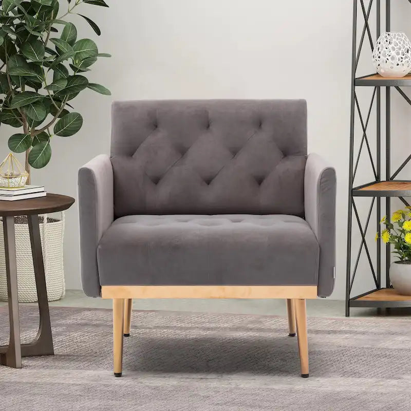Sillón decorativo tapizado de terciopelo con capitonado y patas doradas