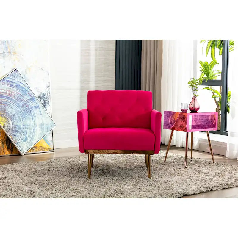 Sillón decorativo tapizado de terciopelo con capitonado y patas doradas