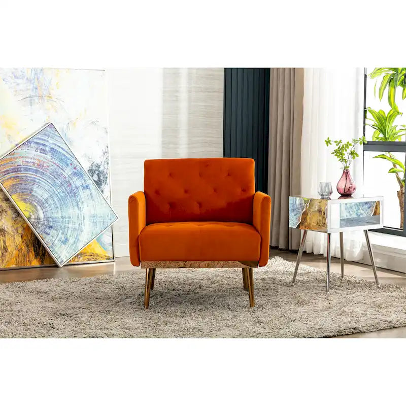 Sillón decorativo tapizado de terciopelo con capitonado y patas doradas
