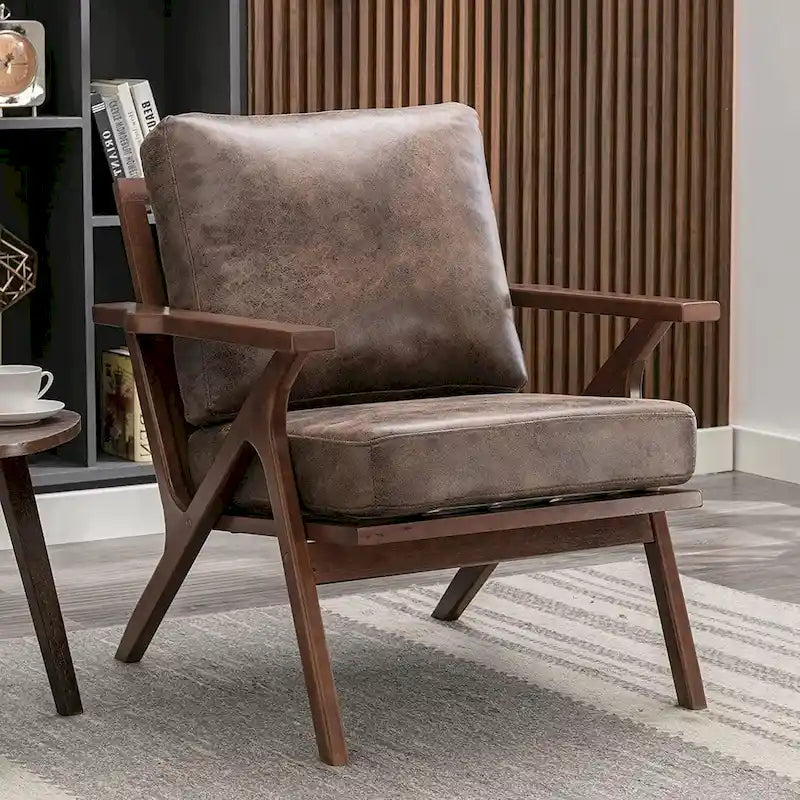 Sillón decorativo de cuero tapizado Ebello con estructura de madera maciza y cojines extraíbles