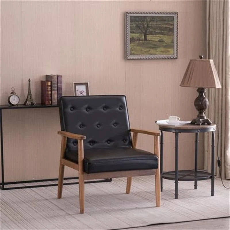 Retro moderne fauteuil van zwart kunstleer