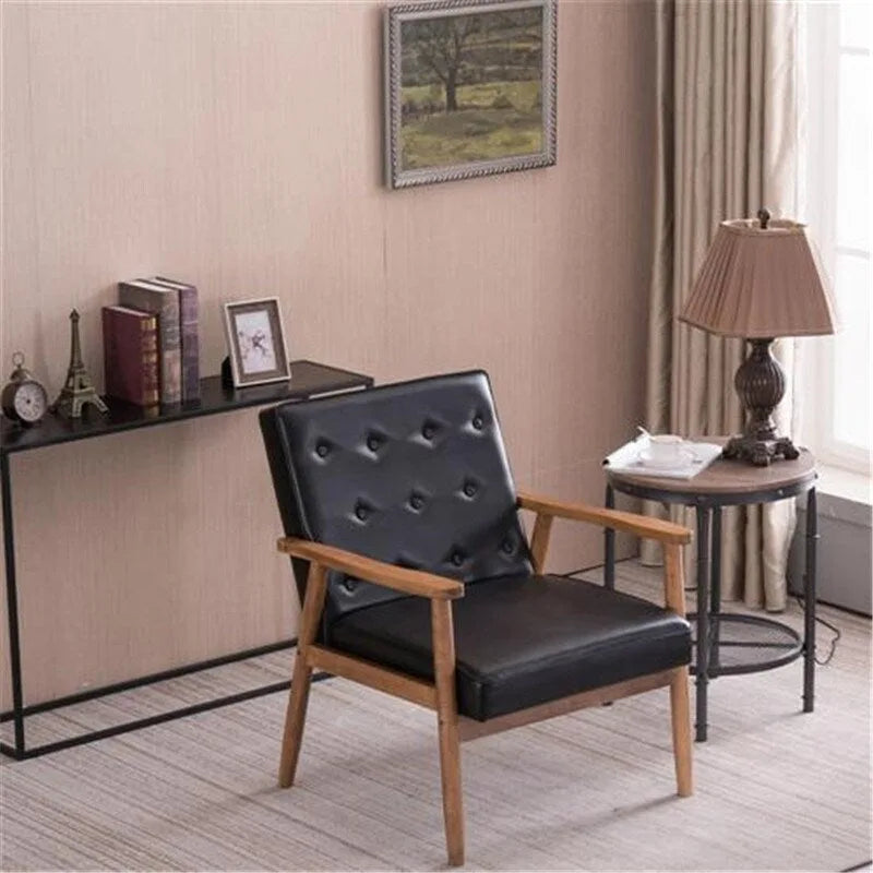 Retro moderne fauteuil van zwart kunstleer