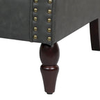 Akzentstuhl aus PU mit gerollten Armlehnen und Nagelkopfverzierung