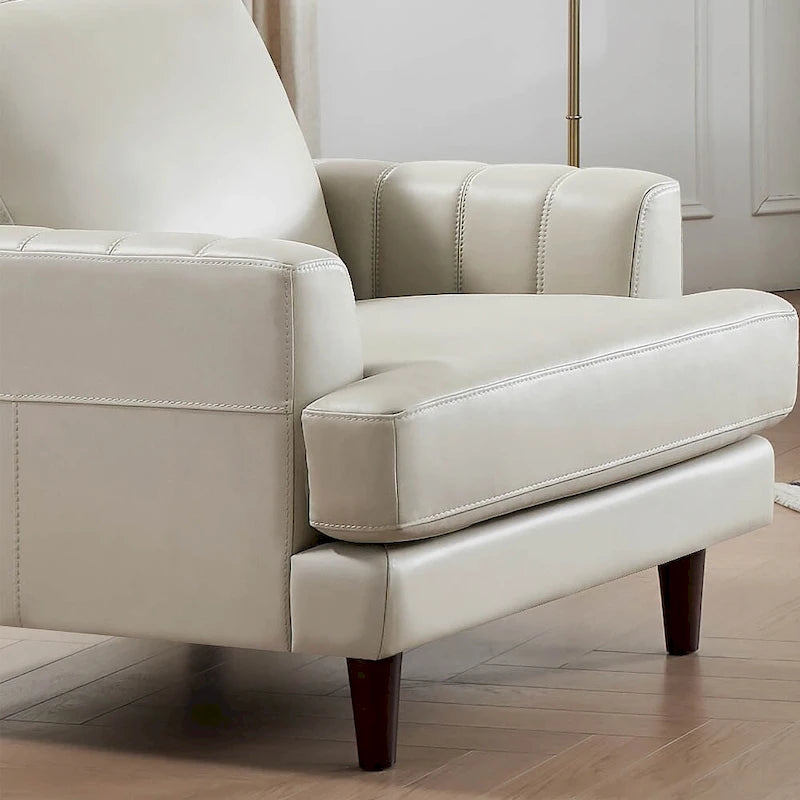 Poltrona in pelle pieno fiore Ivy Living Cassia con imbottitura in piume, memory foam e molle